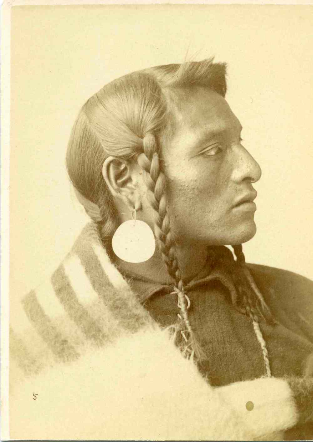 UNIVERSITY OF MANITOBA ARCHIVES AND SPECIAL COLLECTIONS
Portrait of a young Indigenous man in traditional clothing