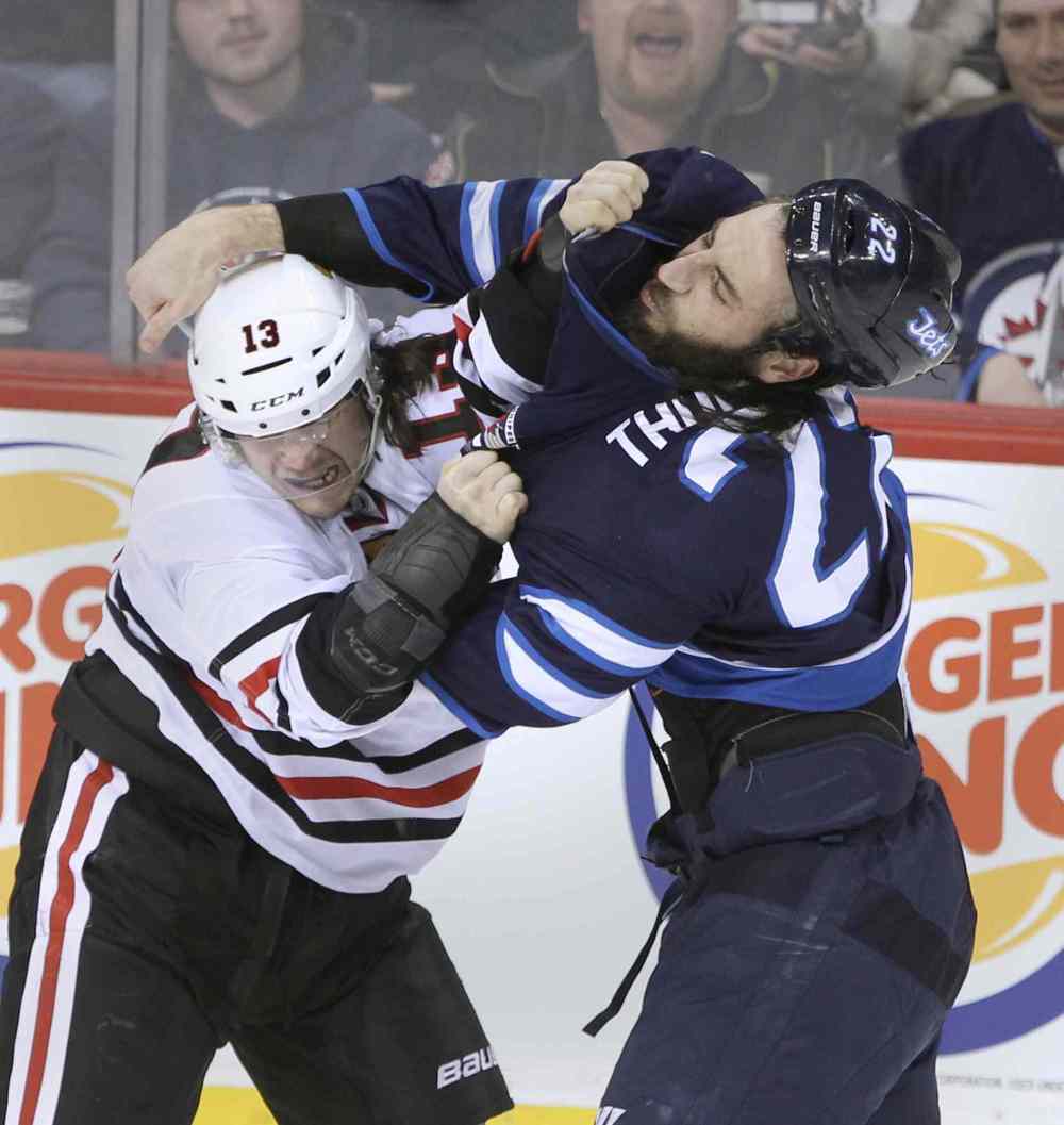 JOE BRYKSA / WINNIPEG FREE PRESS
Winnipeg Jets Chris Thorburn and Chicago Blackhawks Daniel Carcillo fight minutes into the first period during NHL hockey at the MTS Centre in Winnipeg Friday night. Carcillo was suspended by the NHL after a vicious crosscheck on Mathieu Perreault in Chicago Jan 16, 2015.