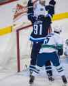DAVID LIPNOWSKI / WINNIPEG FREE PRESS
Winnipeg Jets' Jiri Tlusty (91) celebrates his assist to Jim Slater (not pictured) during first period action against the Vancouver Canucks on Saturday at the MTS Centre.
