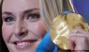 Luca Bruno / The Associted Press
Lindsey Vonn of the United States, shows the gold medal she won in the Women's downhill.