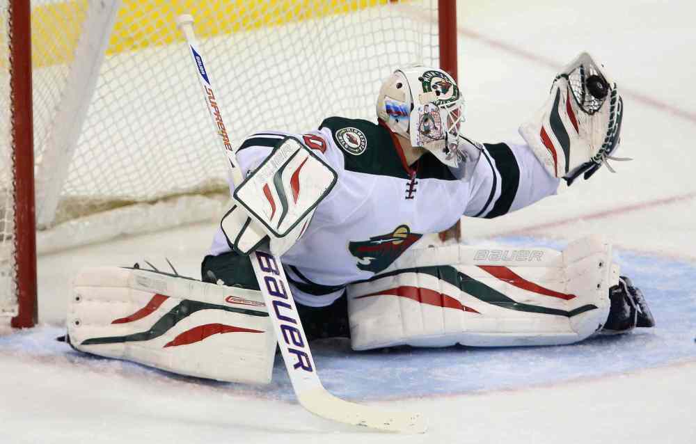 TREVOR HAGAN / THE CANADIAN PRESS
Minnesota Wild goaltender Ilya Bryzgalov makes a glove save during first-period NHL action against the Winnipeg Jets at the MTS Centre in Winnipeg on Monday night.