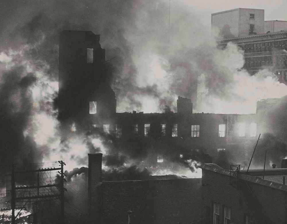 WINNIPEG FREE PRESS FILES
In this photo taken from the Free Press at Portage and Carlton at 8 a.m., the Time Building has collapsed, the Dismorr Block is in ruins and fire rages in the Norlyn Building. Eaton’s is in background at top right.