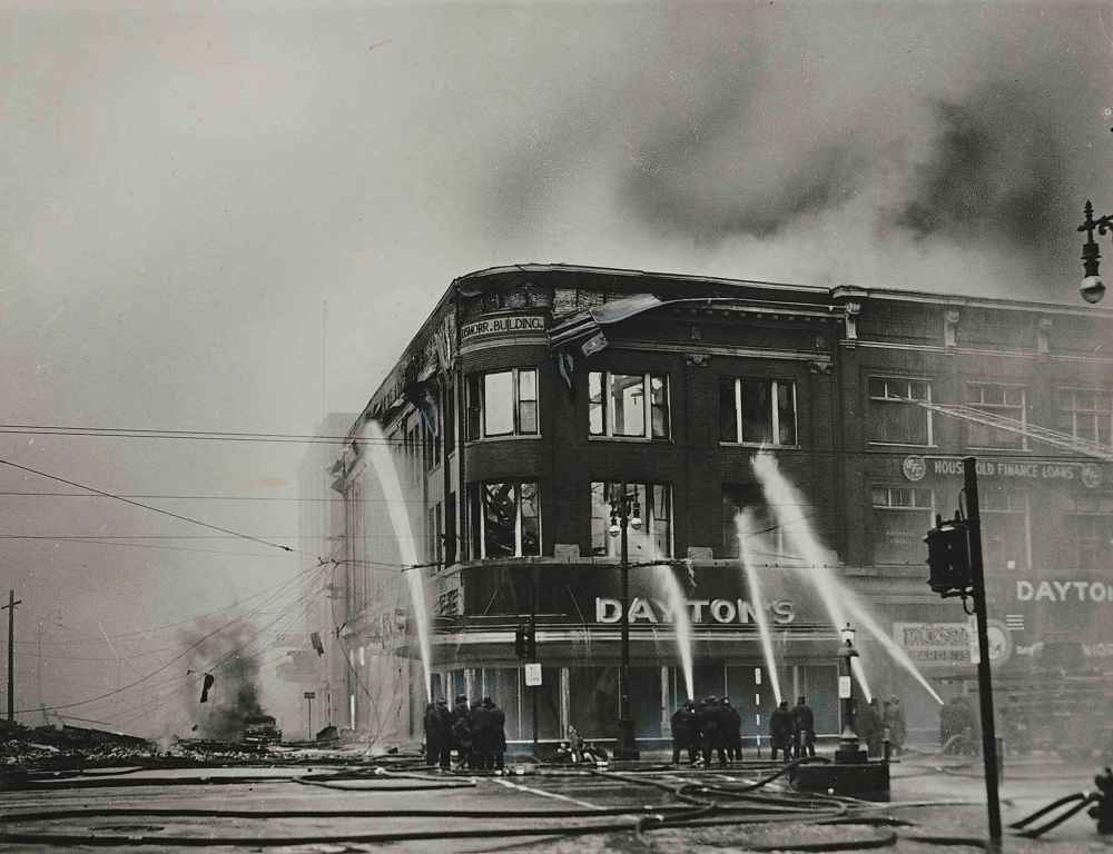 WINNIPEG FREE PRESS FILES
June 8, 1954. Caption found on back of photo: Dismorr Building on Portage Avenue immediately east of Time Building. This building gutted for complete loss. Norlyn Building north of Dismorr Building is just visible (with burning car beside it) through the smoke. Most of this building was destroyed.