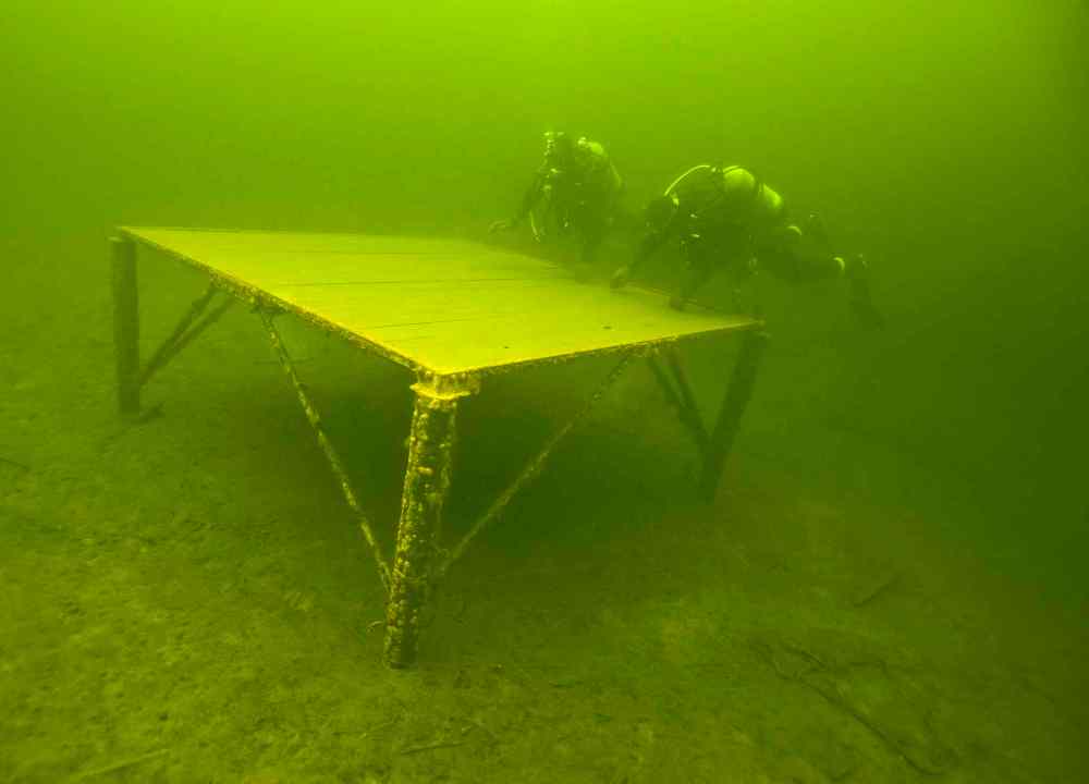Platforms are placed at the bottom of the lake so divers can practice their skills at various depths.
