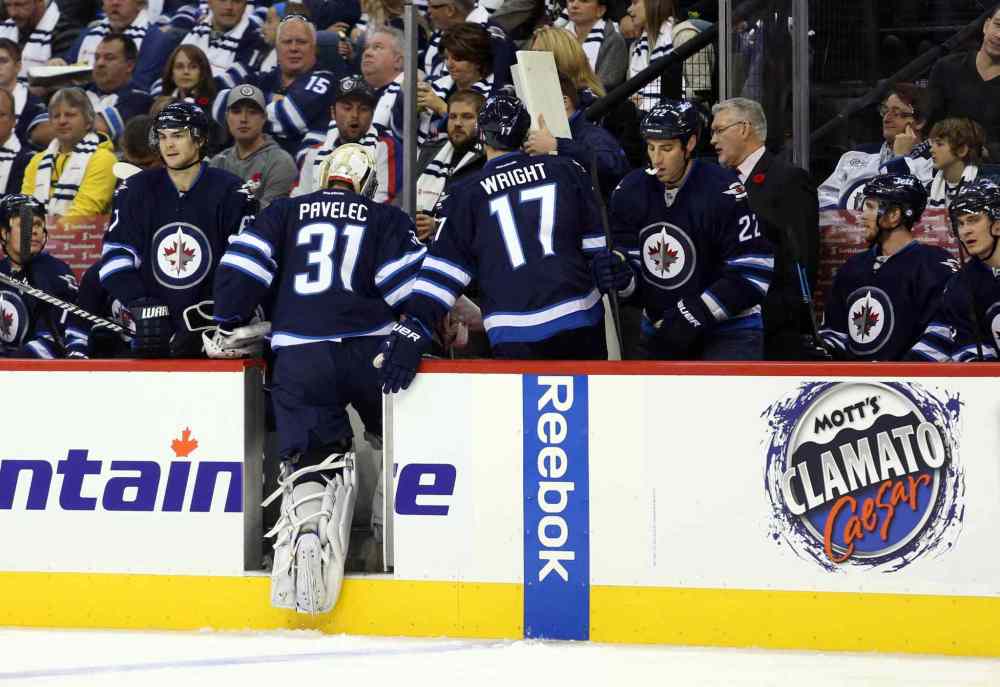 USA Today Sports / Reuters
Winnipeg Jets goalie Ondrej Pavelec heads to the bench after being replaced during the second period.
