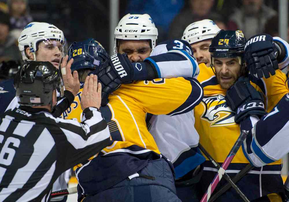 Nick Wagner photo
Players fight during the first period of the game.