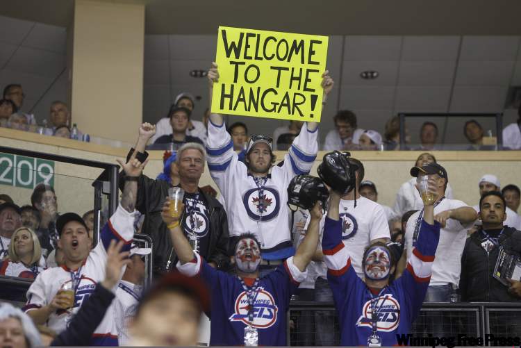 Many fans brought along signs. (Trevor Hagan / Winnipeg Free Press)