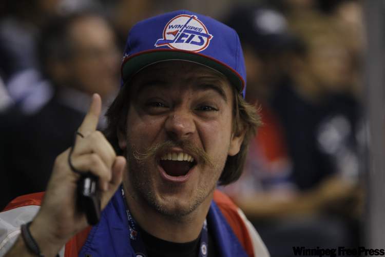 A Winnipeg Jets fan lets out a cheer. (Trevor Hagan / Winnipeg Free Press)