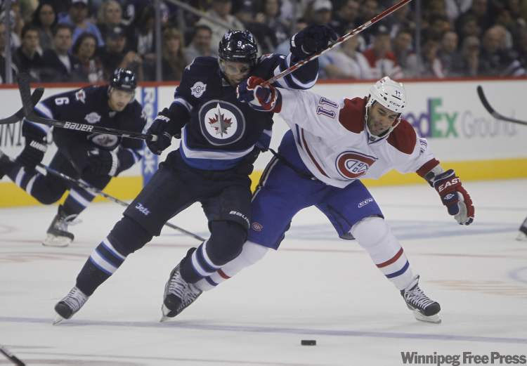 Jet Evander Kane battles with Canadien Scott Gomez during the second-period. (Trevor Hagan / Winnipeg Free Press)