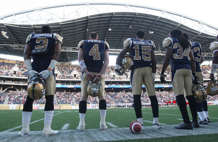 JOE BRYKSA / WINNIPEG FREE PRESS
Winnipeg Blue Bombers stand for the national anthem before the game.
