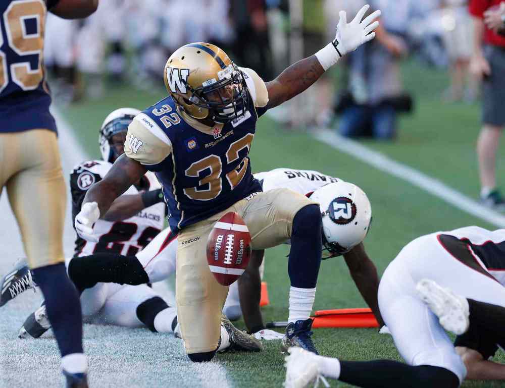 John Woods / The Canadian Press
Winnipeg Blue Bombers' Nic Grigsby (32) disputes an out-of-bounds call in the Ottawa Redblacks' end zone during the first half Thursday's game.