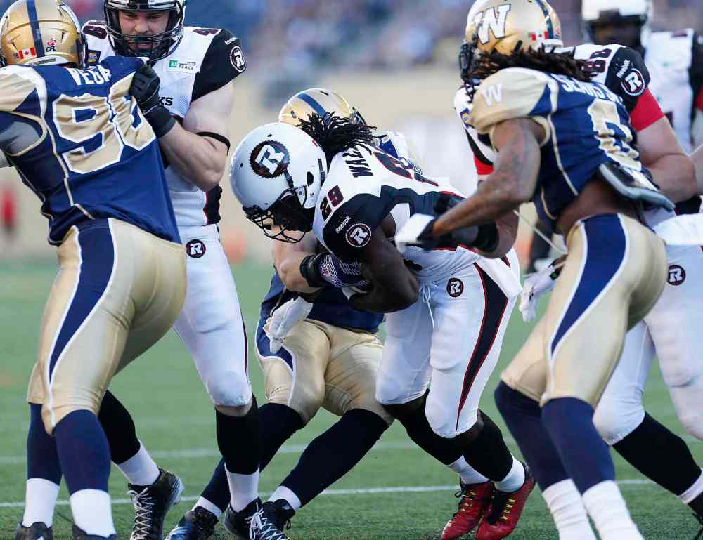 CP
Ottawa Redblacks' Chevon Walker (29) runs the ball in for the team's first touchdown during the first half of Thursday's game against the Blue Bombers.