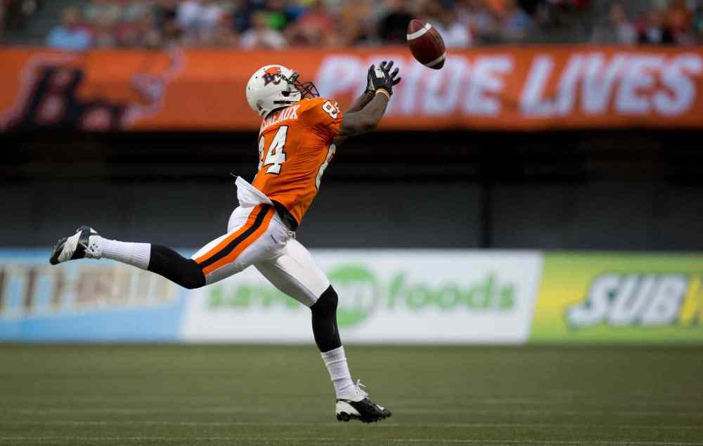 DARRYL DYCK / THE CANADIAN PRESS
B.C. Lions' Emmanuel Arceneaux reaches but fails to make the reception during the first half of Friday's game.