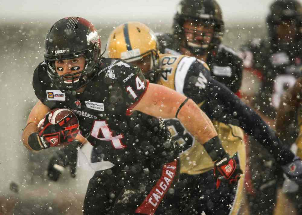 Jeff McIntosh / The Canadian Press
Winnipeg Blue Bombers' Deantre Harlan, right, chases Calgary Stampeders' Matt Walter during the second half of Saturday's game.