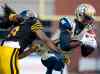Nathan Denette / The Canadian Press
Hamilton Tiger-Cats' linebacker Rico Murray, left, tackles Winnipeg Blue Bombers' receiver Aaron Kelly, right, during the first half of Thursday's game.