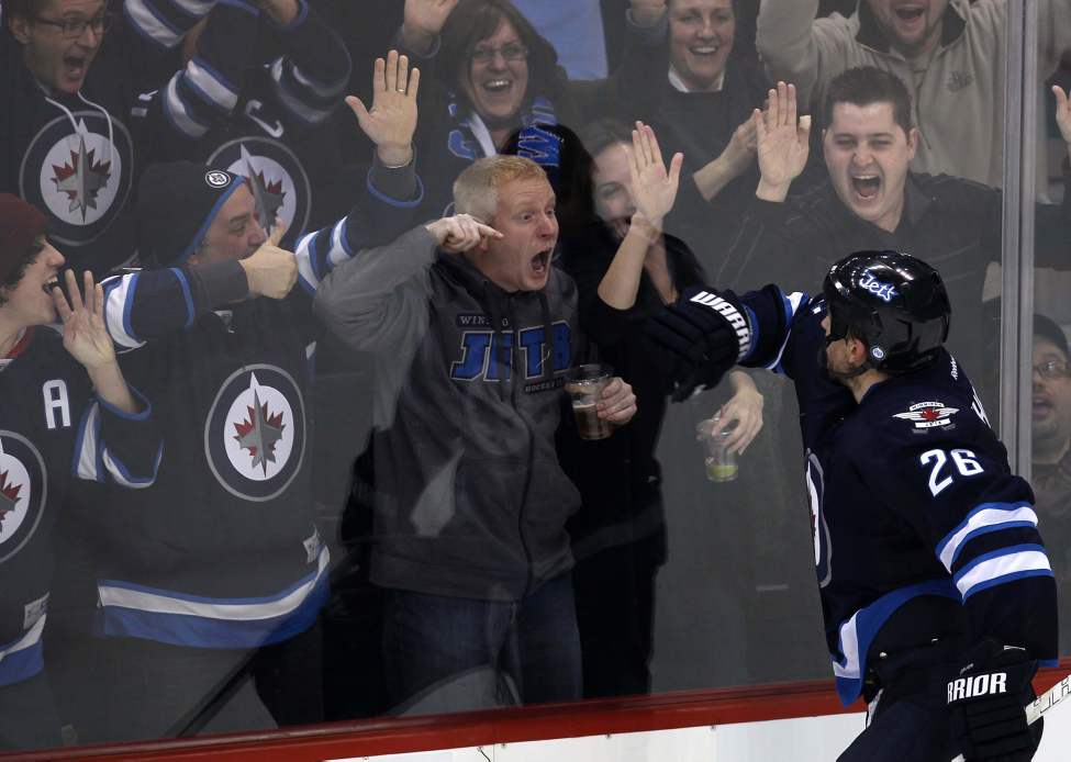 Photographer's choice: The 119-day NHL lockout was felt hard by Winnipeg Jets fans as it happened at the beginning of our second year back in the big leagues. On their second game on home ice since the lockout ended, the Jets played host to Sidney Crosby and the Pittsburg Penguins. Crosby scored twice in the opening period but the Jets rallied back and won. Blake Wheeler scored on an empty net and sealed the big win at 18:51 in the third. The fans went wild, and I just loved the intense passion of the fans that night.
January 25, 2013 (JOE BRYKSA / WINNIPEG FREE PRESS)