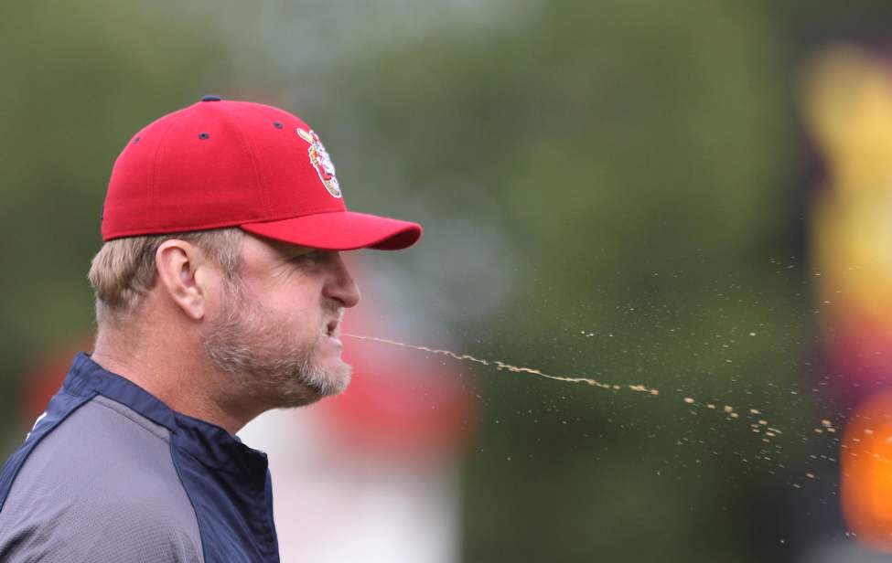 Winnipeg Goldeyes manager Rick Forney spits out chewing tobacco during a game against the Sioux Falls Canaries at Shaw Park. August 09, 2013 (JOE BRYKSA / WINNIPEG FREE PRESS)