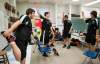 DAVID LIPNOWSKI/WINNIPEG FREE PRESS
(L-R) Quinton Hart, Wyatt Daley, Alan-Michael Whitmore, and Aaron McDonald stretch prior to their game against the Reston School Tigers.