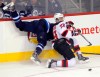 BORIS MINKEVICH / WINNIPEG FREE PRESS
The Jets' Evander Kane gets creamed by the New Jersey Devils' Damon Severson in the first period.