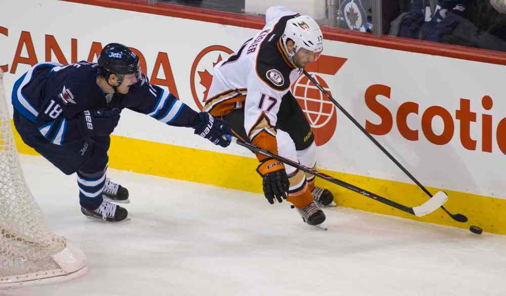 DAVID LIPNOWSKI / WINNIPEG FREE PRESS
Anaheim Ducks Ryan Kesler (#17) battles Winnipeg Jets Bryan Little (#18) for the puck during first period Saturday.