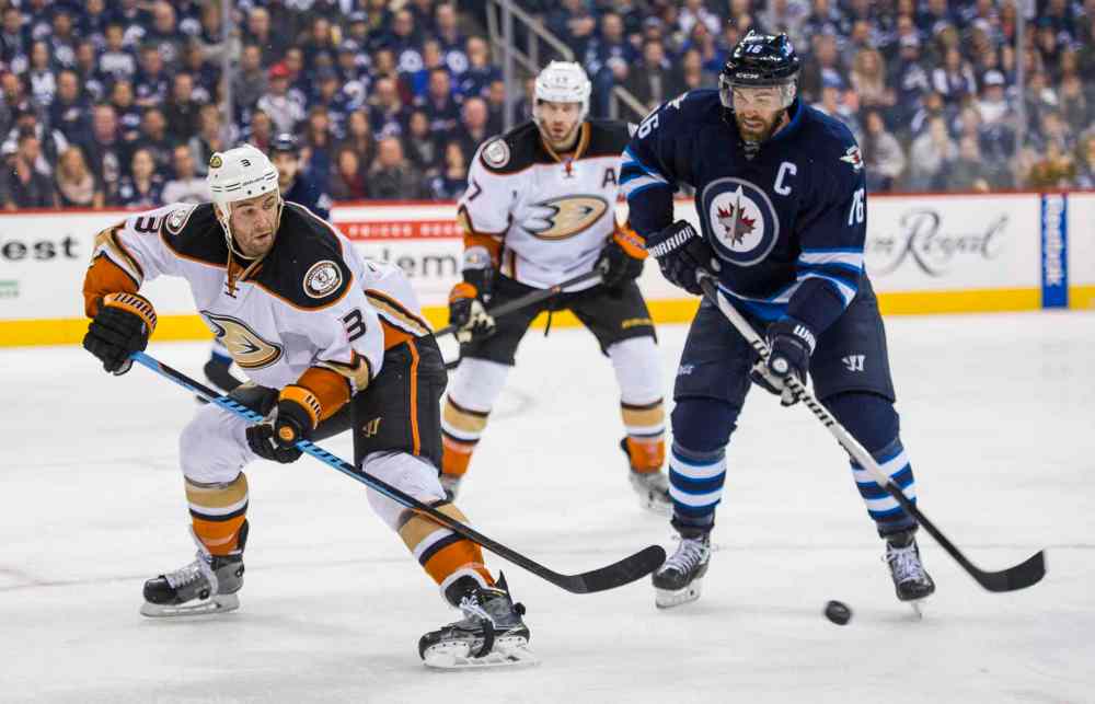 DAVID LIPNOWSKI / WINNIPEG FREE PRESS
Anaheim Ducks Clayton Stoner (#3) eyes up Winnipeg Jets Andrew Ladd (#16) during second period.
