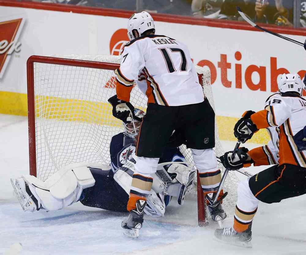 John Woods / The Canadian Press
Anaheim Ducks' Ryan Kesler (17) knocks Winnipeg Jets goaltender Michael Hutchinson (34) into the net and draws a goalie interference penalty during first period.