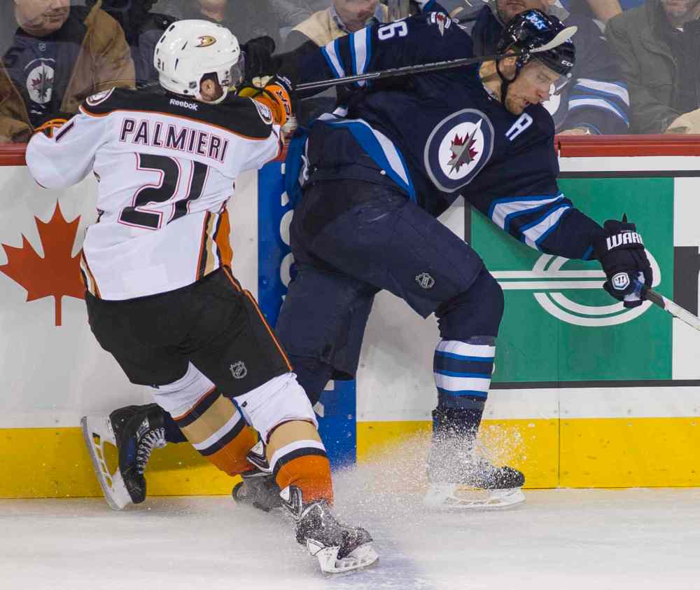 DAVID LIPNOWSKI / WINNIPEG FREE PRESS
Anaheim Ducks Kyle Palmieri (21) hits Winnipeg Jets Blake Wheeler (#26) in the head with his stick during the first period of Saturday's game.