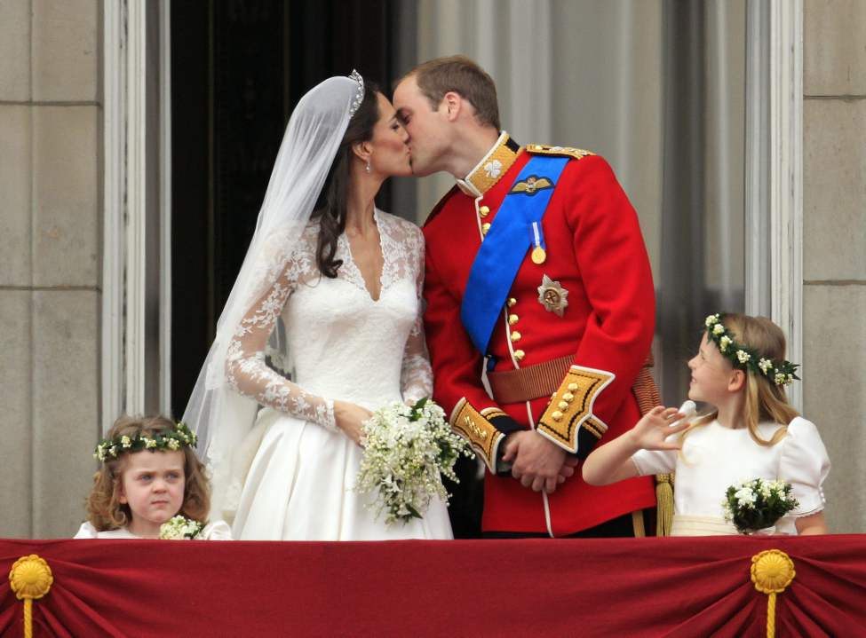 CP
Britain's Prince William kisses his wife Kate, Duchess of Cambridge on the balcony of Buckingham Palace after the Royal Wedding in London Friday, April, 29, 2011. (AP Photo/Matt Dunham)