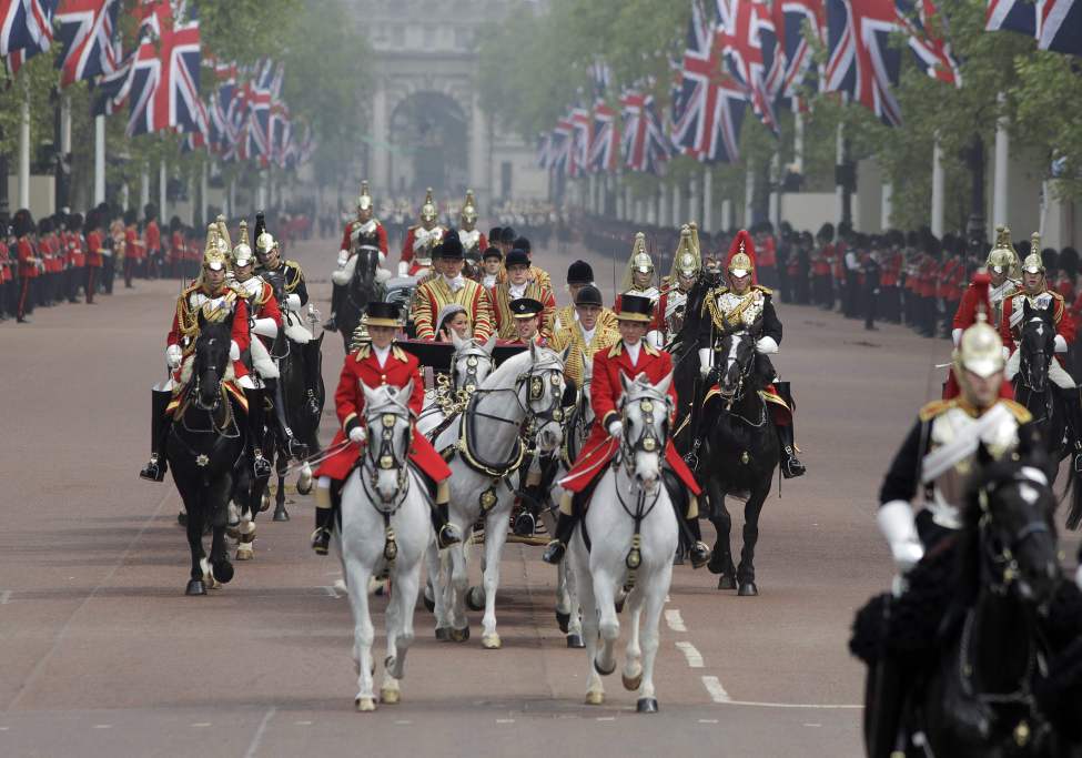 CP
Britain's Prince William and his wife Kate, Duchess of Cambridge make their way to Buckingham Palace after the Royal Wedding in London Friday, April, 29, 2011. (AP Photo/Lefteris Pitarakis)