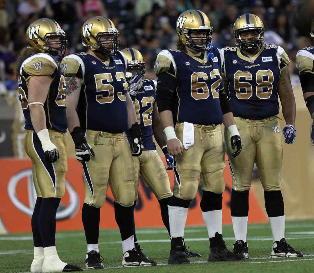 Phil Hossack / Winnipeg Free Press
About all the Winnipeg Blue Bombers' offensive linemen could do was stare down the Edmonton Eskimos late in the game Thursday.