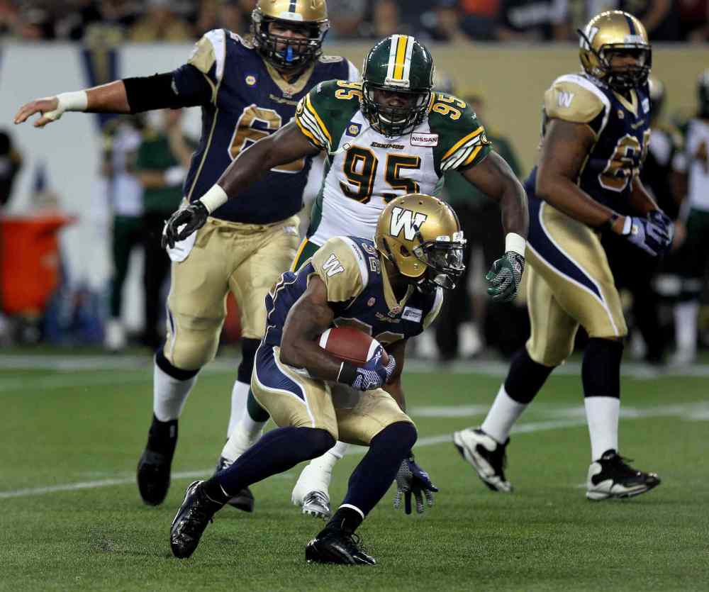 Phil Hossack / Winnipeg Free Press
Winnipeg Blue Bombers' #32 Nic Grigsby looks for room in the third quarter against the Edmonton Eskimos.