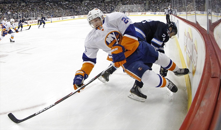 Trevor Hagan / Winnipeg Free Press
New York Islanders' Brad Boyes is checked by Grant Clitsome during the second period.