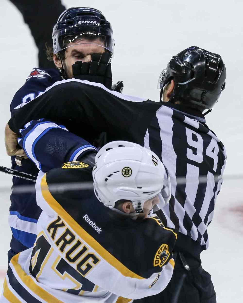 Crystal Schick/Winnipeg Free Press
Winnipeg Jets' Eric Tangradi (#27) fights with Boston Bruins' Torey Krug (#47) during the second period of Thursday's game.