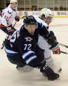 Sean Kilpatrick / The Canadian Press
Capitals' Nate Schmidt checks the Jets' Scott Kosmachuk during pre-season NHL hockey action in Belleville, Ont., on Saturday.