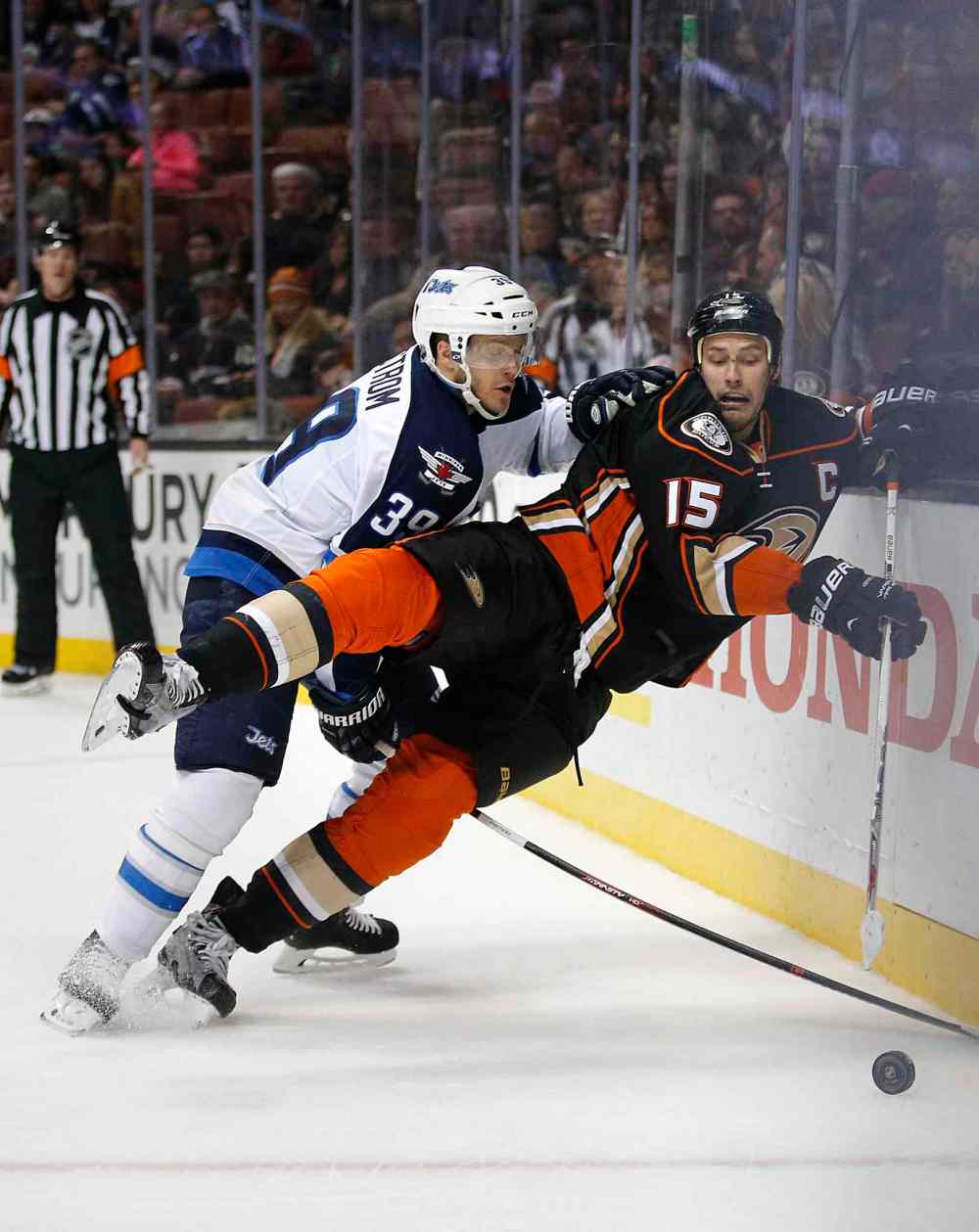 Jae C. Hong / The Associated Press
Anaheim Ducks' Ryan Getzlaf, right, is pushed by Winnipeg Jets' Toby Enstrom in second period.