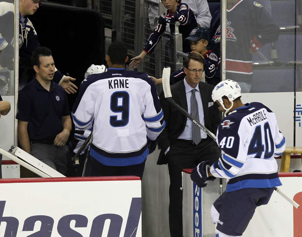 The Winnipeg Jets vs.Columbus Blue Jackets at Nationwide Arena in Columbus, Ohio. The Winnipeg Jets come off the ice under the watchful eye of owner Mark Chipman (in suit). Sept. 20, 2011 (BORIS MINKEVICH / WINNIPEG FREE PRESS)