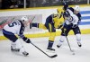 Mark Humphrey / The Associated Press
Nashville Predators center Filip Forsberg (9) moves the puck between Winnipeg Jets defenders Matt Halischuk (15) and Tobias Enstrom (39) in the first period of Saturday's game.