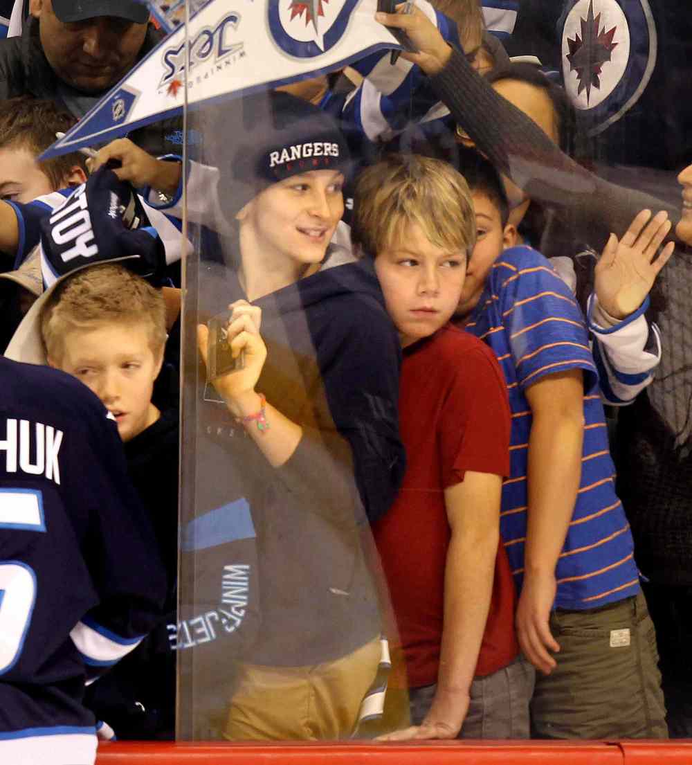 Phil Hossack / Winnipeg Free Press
A crush for autographs ensues among young fans at the annual Winnipeg Jets Skills Competition.