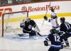 Trevor Hagan / The Canadian Press 
Minnesota Wild forward Jason Zucker (16) scores on Winnipeg Jets' goaltender Michael Hutchinson (34) just 10 seconds into first period NHL hockey action in Winnipeg Sunday. (Trevor Hagan / The Canadian Press)