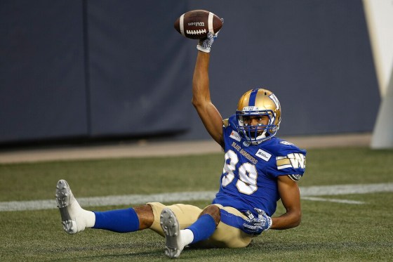 Kenny Lawler celebrates his second touchdown of the night against the Hamilton Tiger-Cats on Thursday. (John Woods / The Canadian Press)