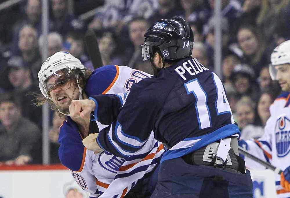 MIKE DEAL / WINNIPEG FREE PRESS
Winnipeg Jets' Anthony Peluso (14) and Edmonton Oilers' Luke Gazdic (20) fight during Wednesday's game.