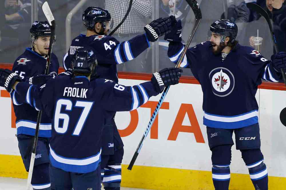 John Woods / Winnipeg Free Press
Winnipeg Jets' Mathieu Perreault (85) celebrates one of his two first-period goals against the Florida Panthers.
