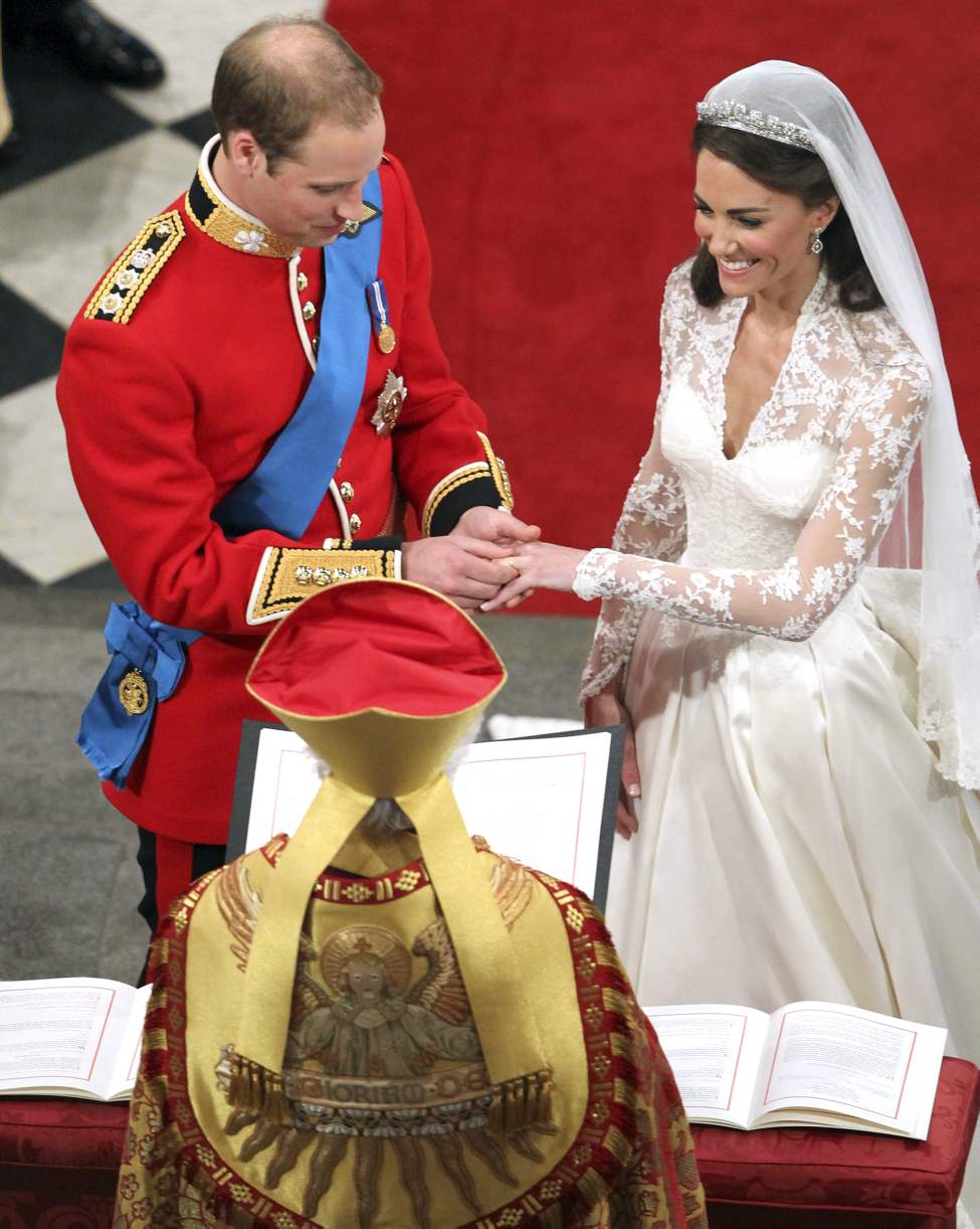 CP
Britain's Prince William and his bride Kate Middleton exchange rings during their wedding service at Westminster Abbey, London, Friday April 29, 2011. (AP Photo/Andrew Milligan, Pool)
