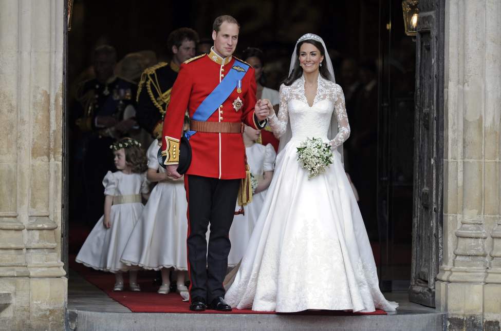 CP
Britain's Prince William and his wife Kate, Duchess of Cambridge stand outside of Westminster Abbey after their Royal Wedding in London Friday, April, 29, 2011. (AP Photo/Martin Meissner)