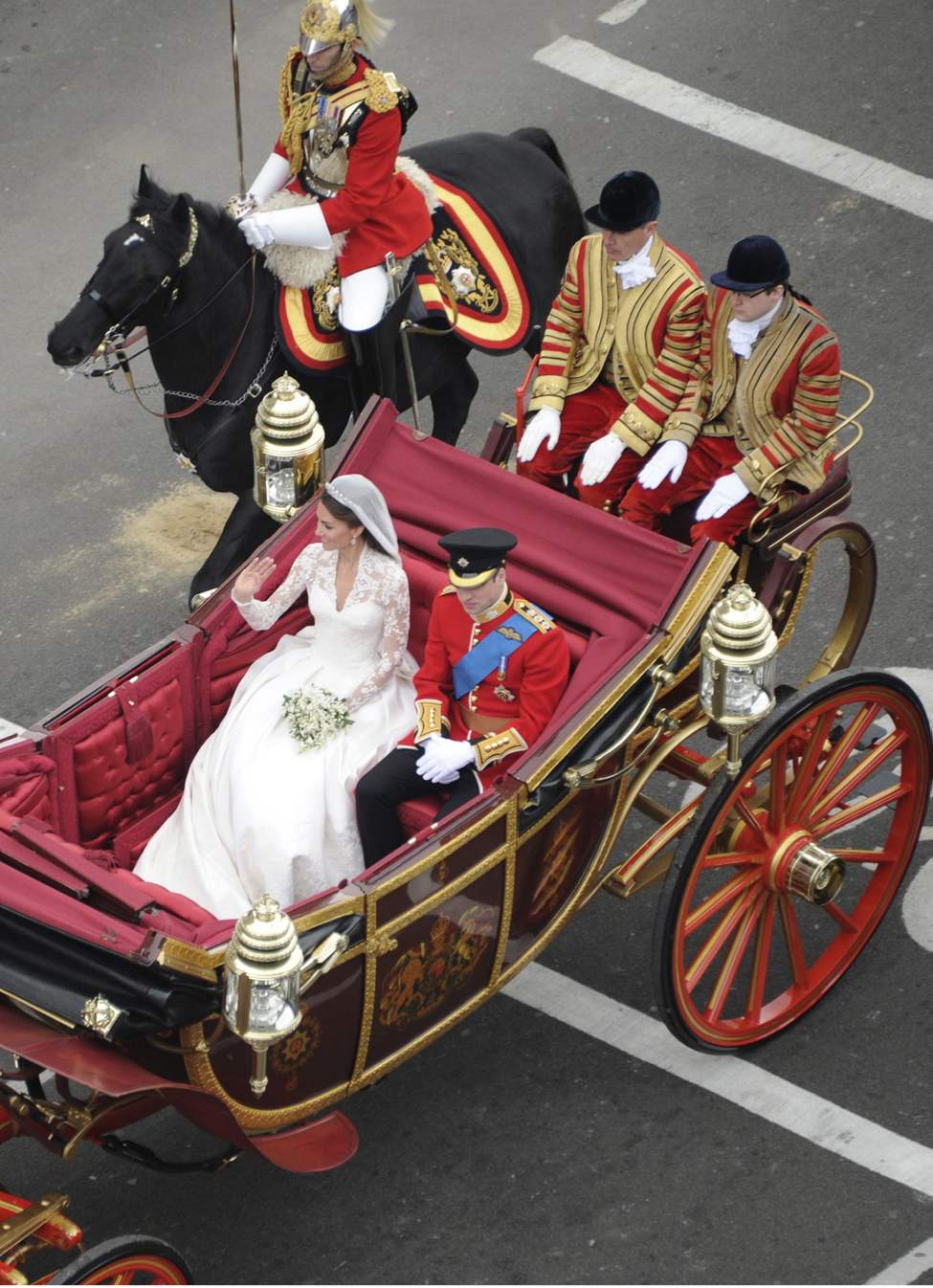 Tribune Media MCT
Prince William and his new bride, Kate Middleton, ride in a carriage after their wedding in London, England, on Friday, April 29, 2011. (Abaca Press/MCT)