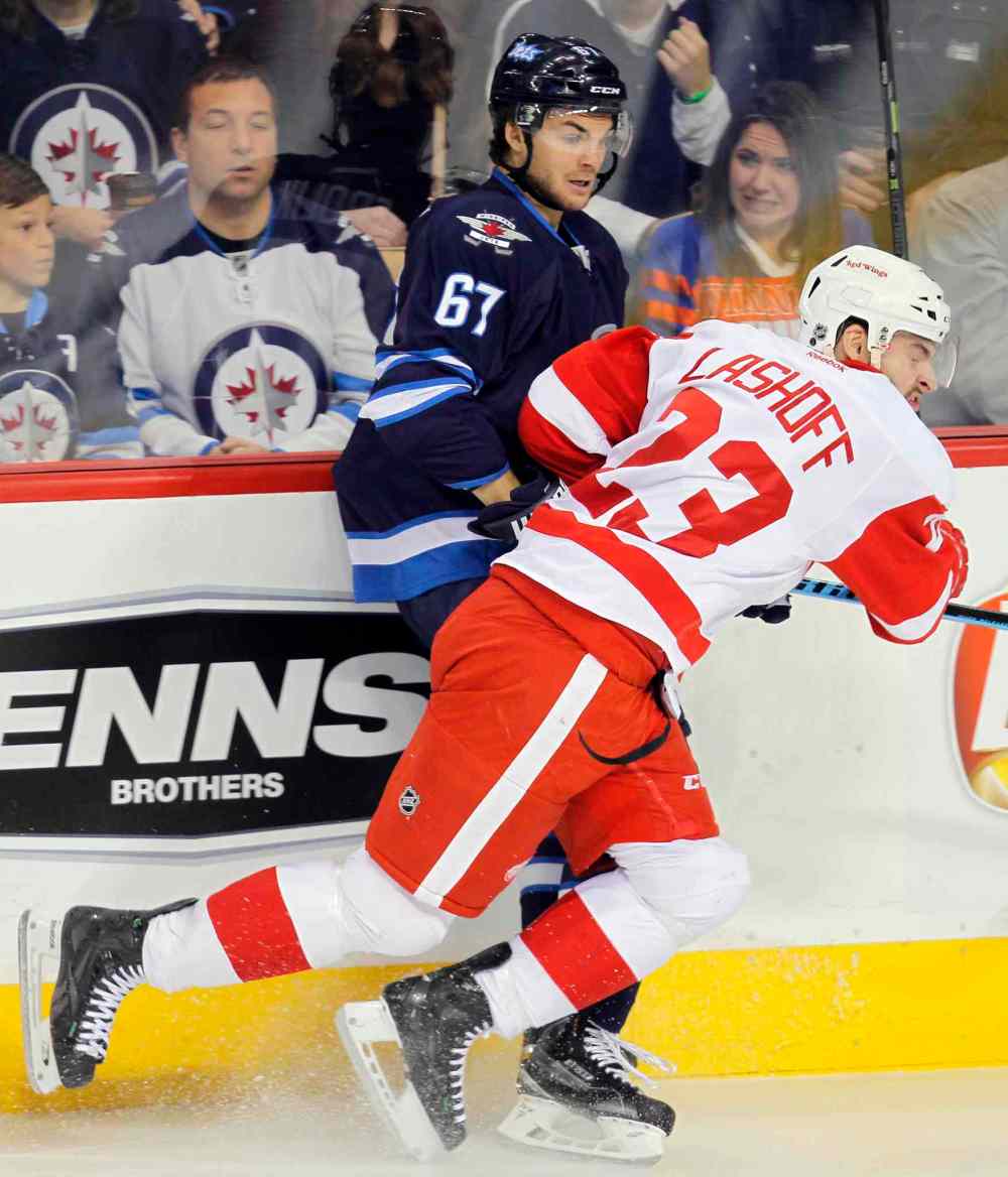 BORIS MINKEVICH / WINNIPEG FREE PRESS
The Jets' Michael Frolik gets in on the second-period action Thursday.