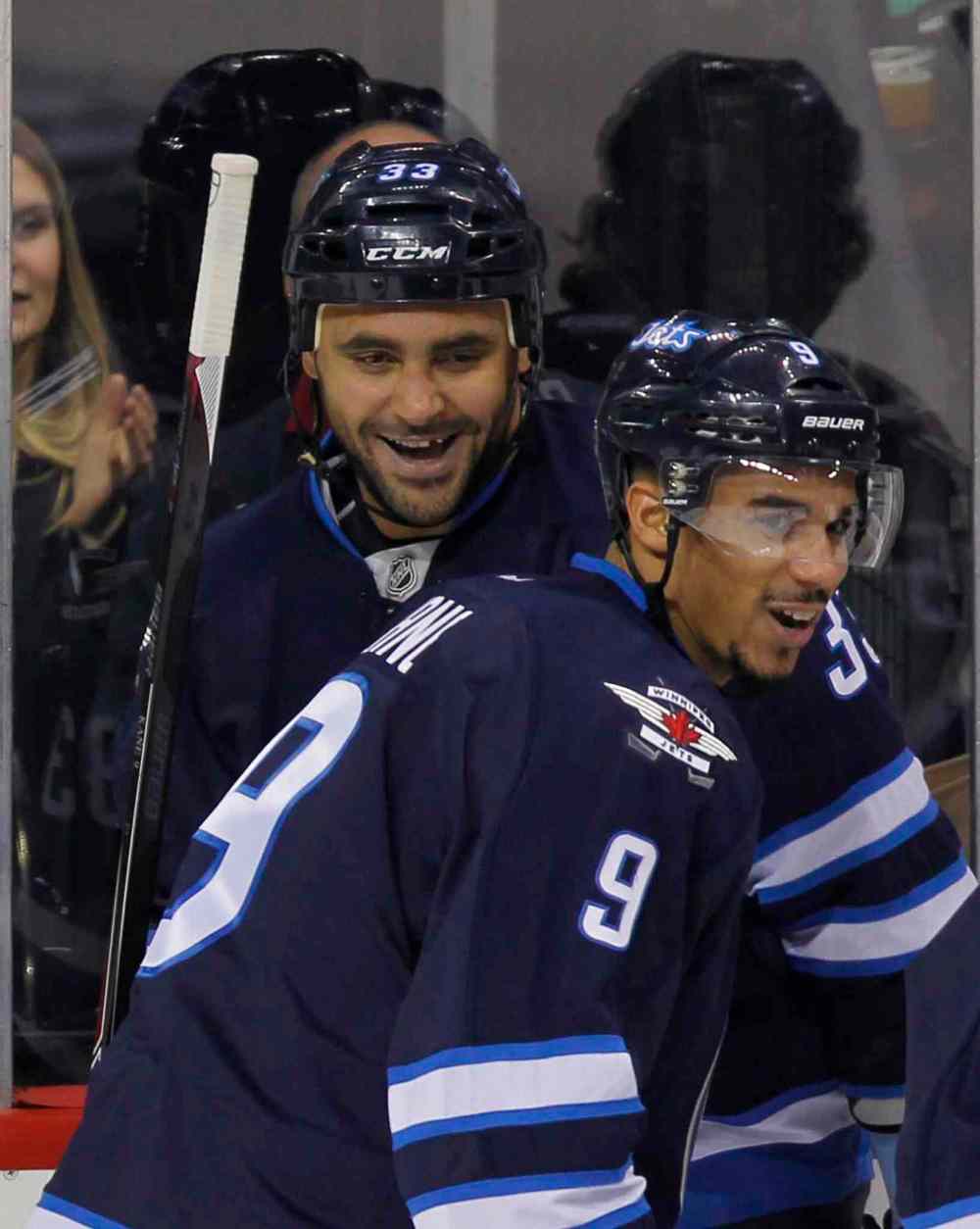 Boris Minkevich / Winnipeg Free Press
Dustin Byfuglien celebrates his second-period goal with his Jets teammates.