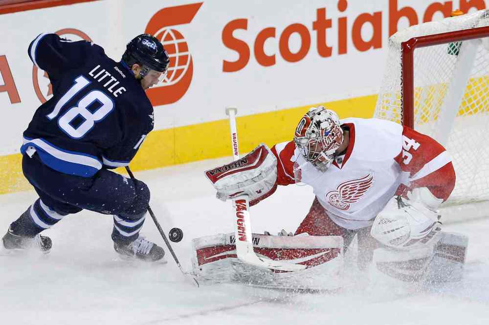 John Woods / The Canadian Press
Detroit Red Wings' goaltender Petr Mrazek (34) shuts down the rush by Winnipeg Jets' Bryan Little (18) during the first period.