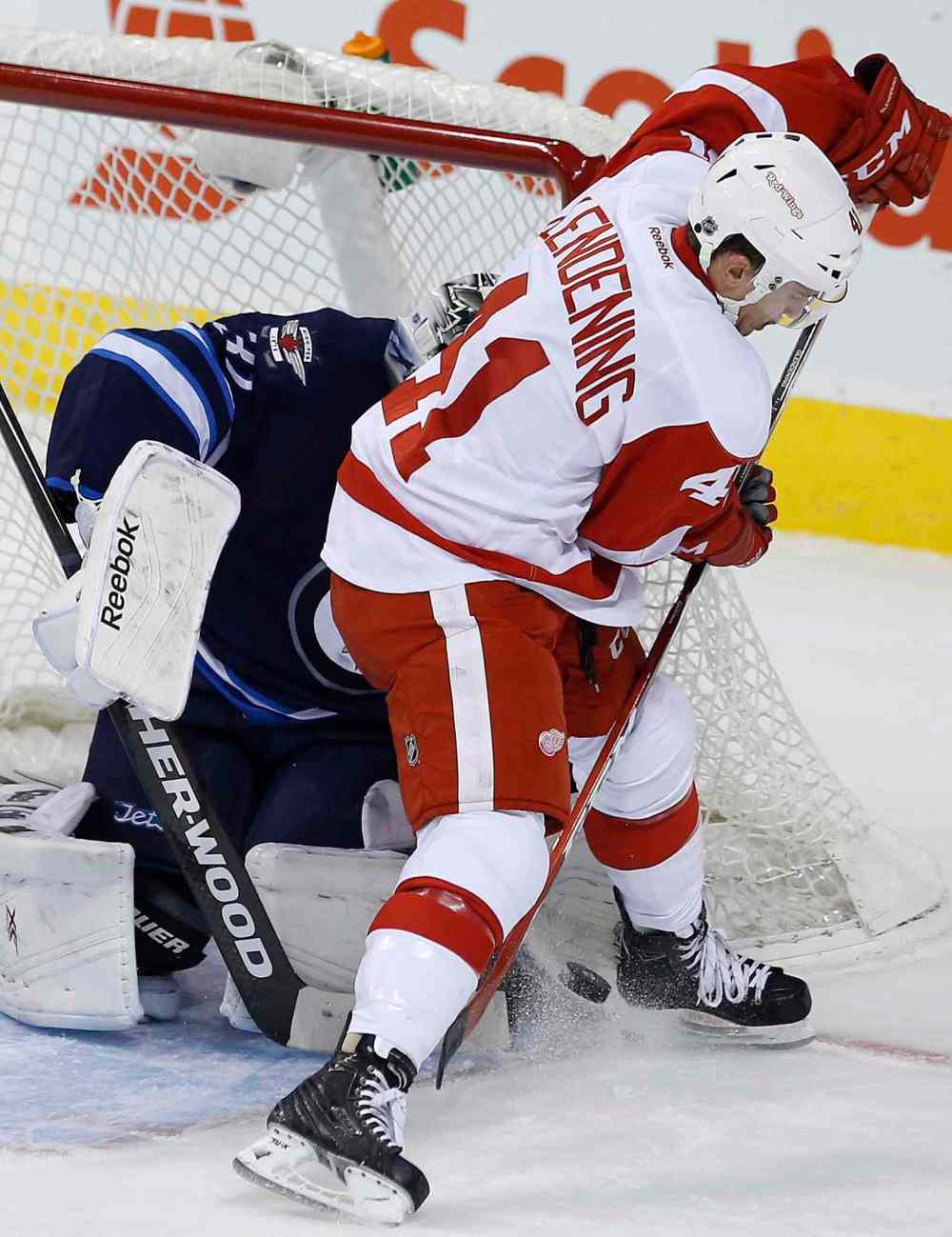 John Woods / The Canadian Press
Winnipeg Jets' goaltender Ondrej Pavelec (31) stops a first-period backhander from Detroit Red Wings' Luke Glendening (41).