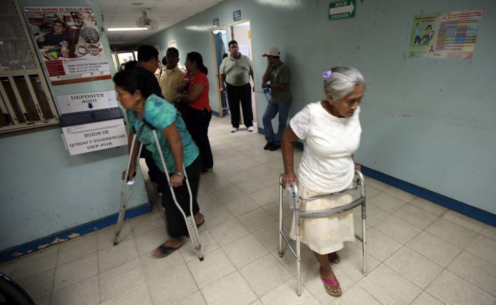 Patients on walkers and crutches arrive for an assessment at the clinic.